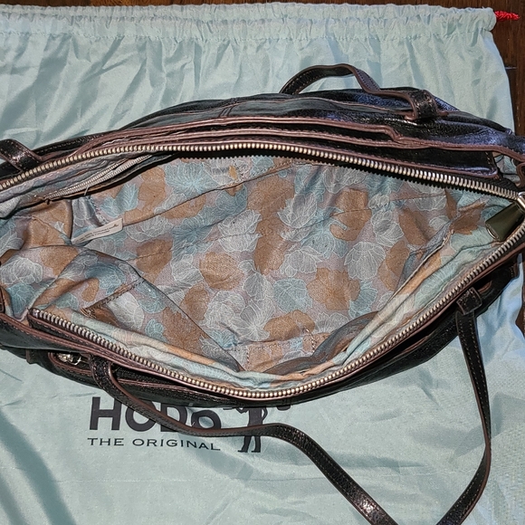 Hobo brand purse. Medium sized bag. Black with blue and maroon material inside. - Picture 2 of 2